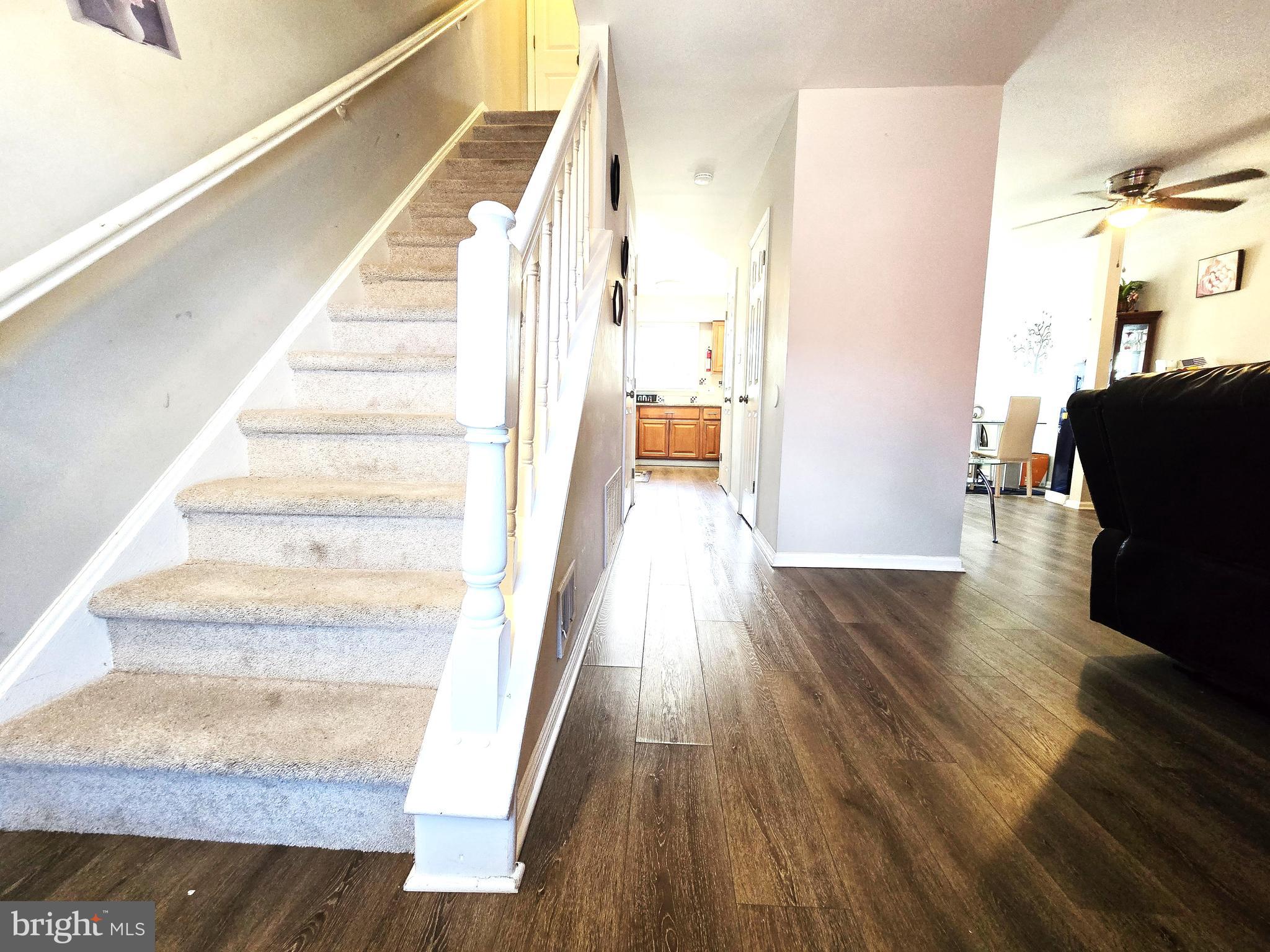3 Arnold Place Newark, DE 19702 - Photo 8 of 28 a view of entryway and hall with wooden floor