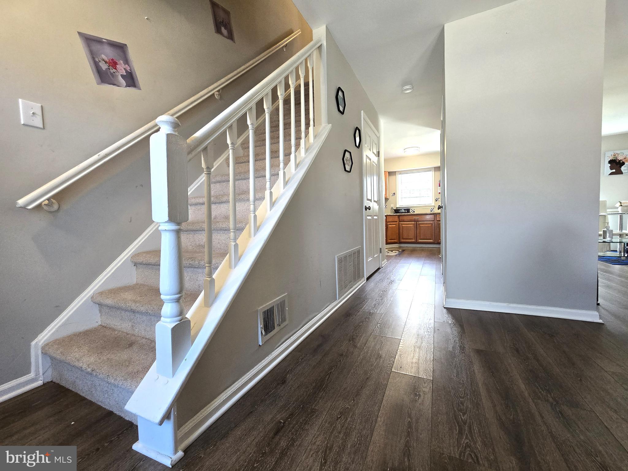 3 Arnold Place Newark, DE 19702 - Photo 9 of 28 a view of entryway and hall with wooden floor