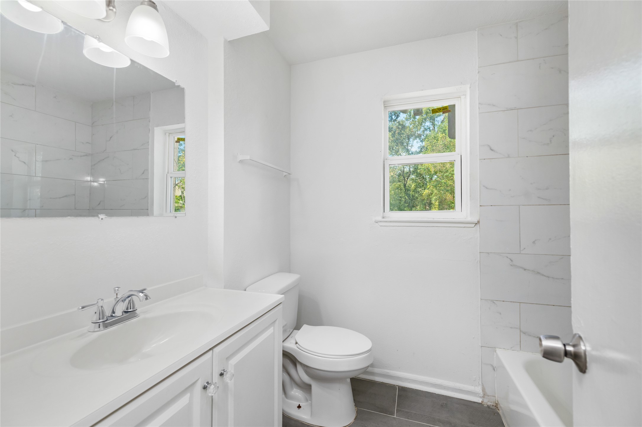9322 Nyssa Street Houston, TX 77078 - Photo 12 of 34 a bathroom with a sink toilet and vanity