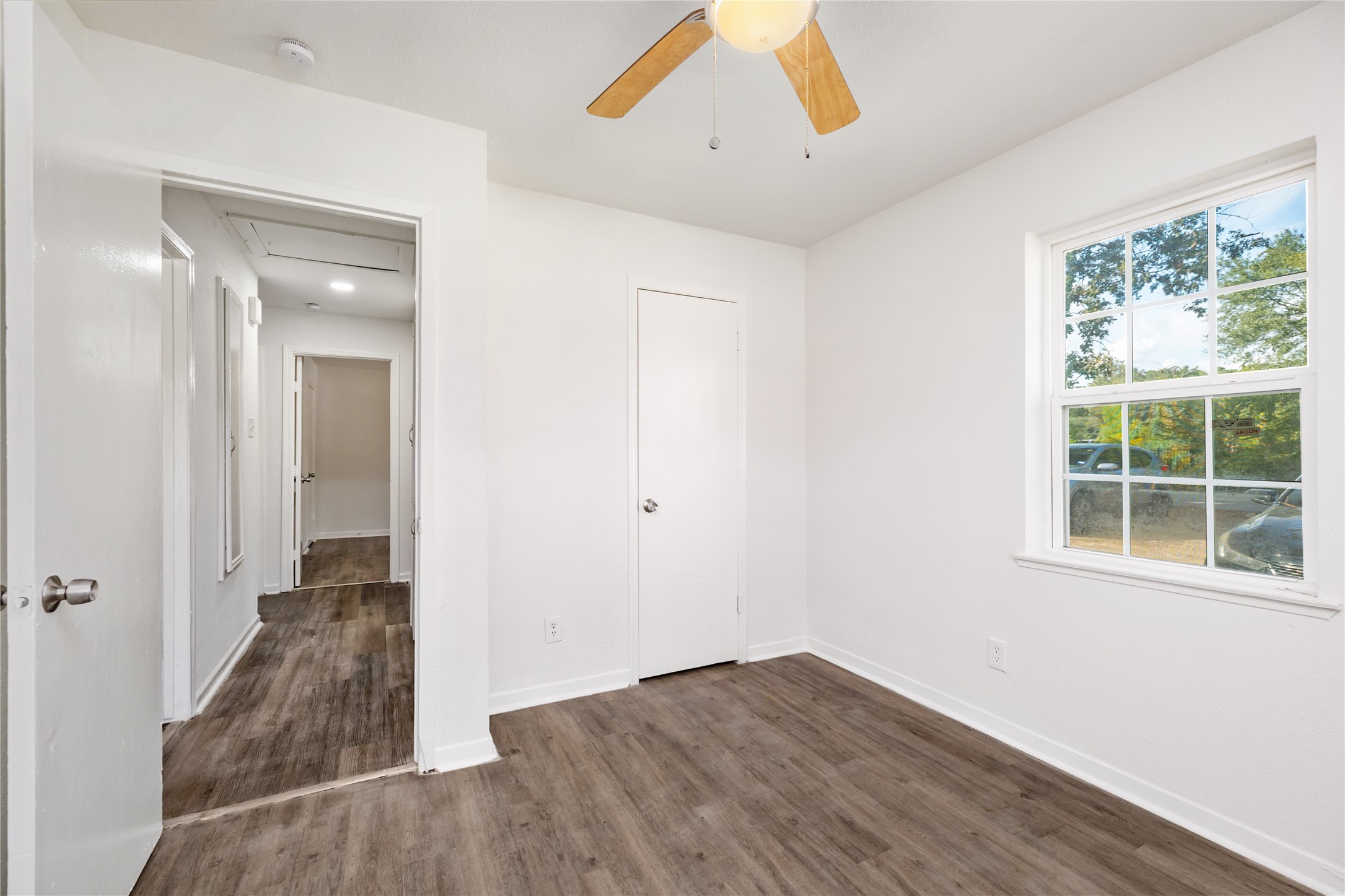 9322 Nyssa Street Houston, TX 77078 - Photo 14 of 34 a view of empty room with wooden floor and fan