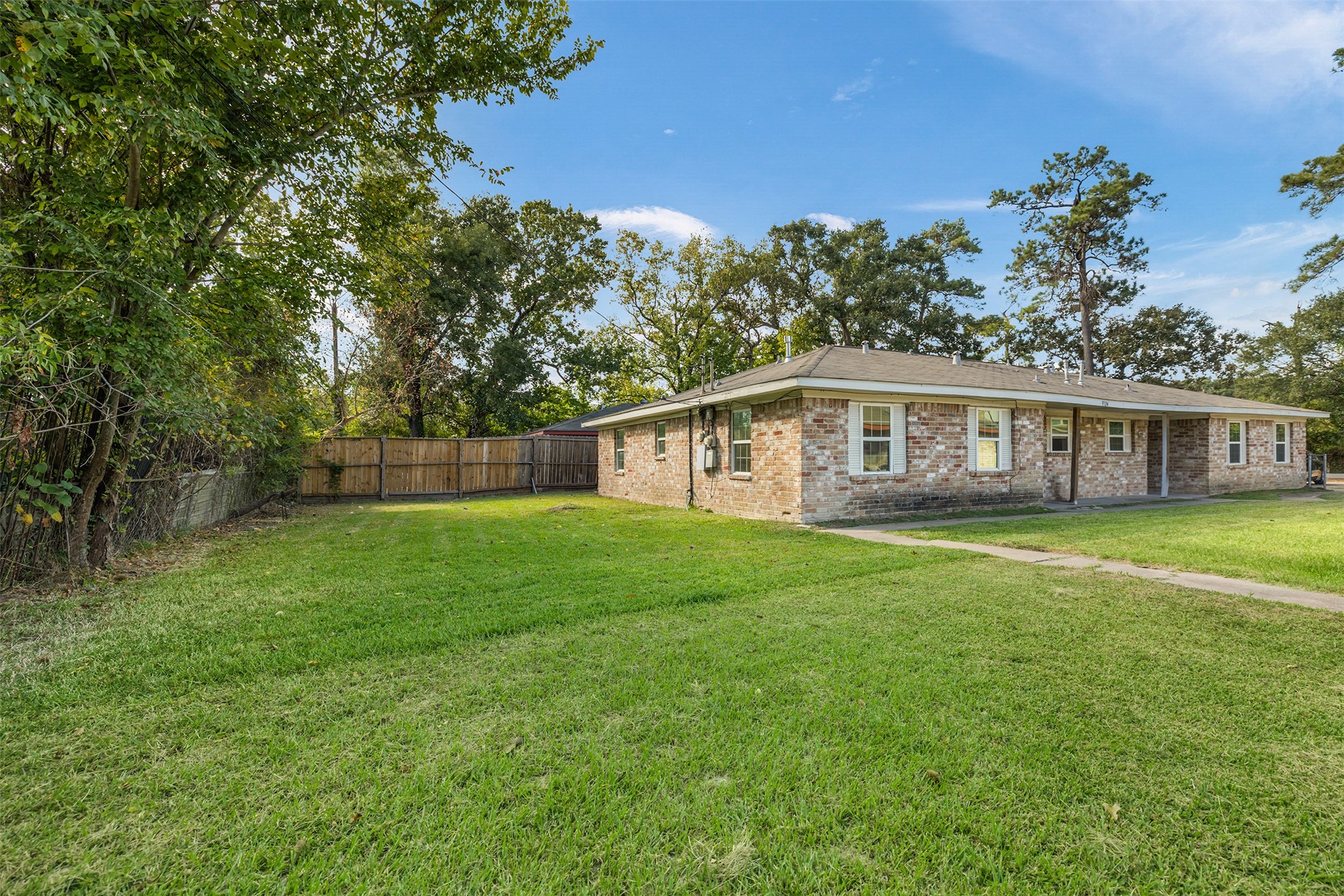 9322 Nyssa Street Houston, TX 77078 - Photo 34 of 34 a view of a house with backyard and garden