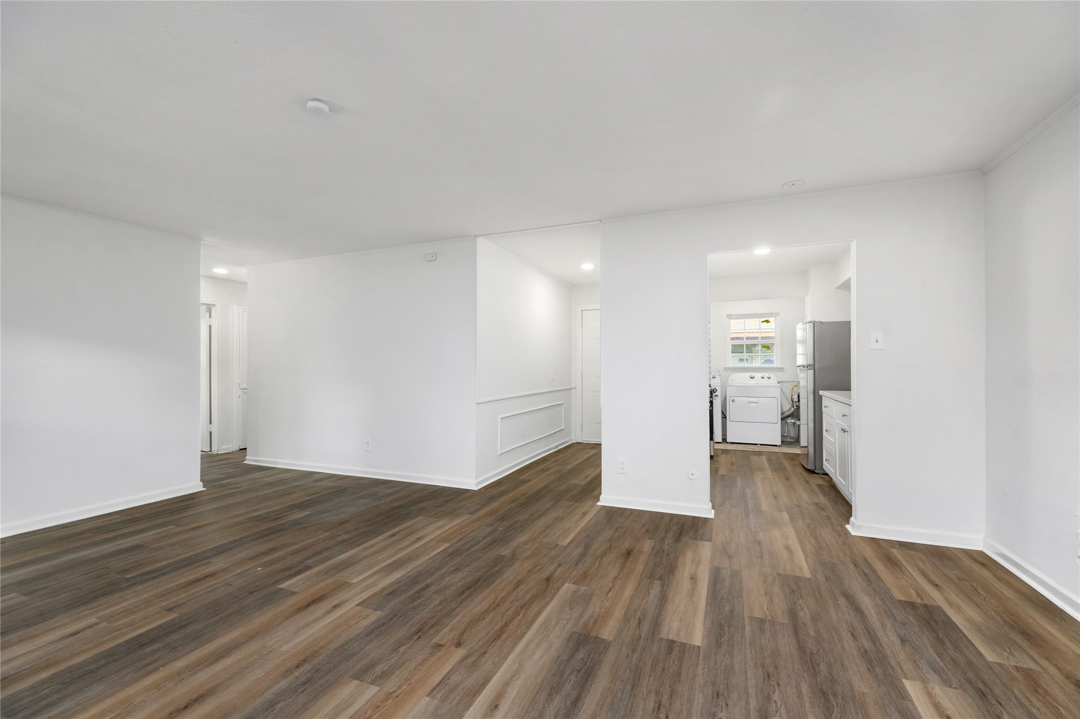 9322 Nyssa Street Houston, TX 77078 - Photo 4 of 34 a view of empty room with wooden floor