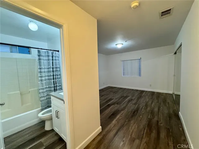a view of bathroom with toilet shower and a bathtub