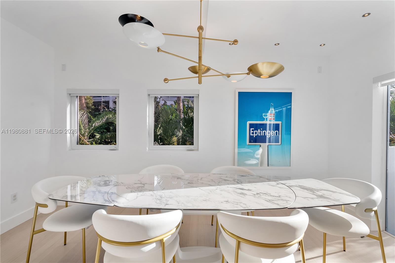 828 3rd Street, Unit 314 Miami Beach, FL 33139 - Photo 12 of 28 a kitchen with a table and chairs in it