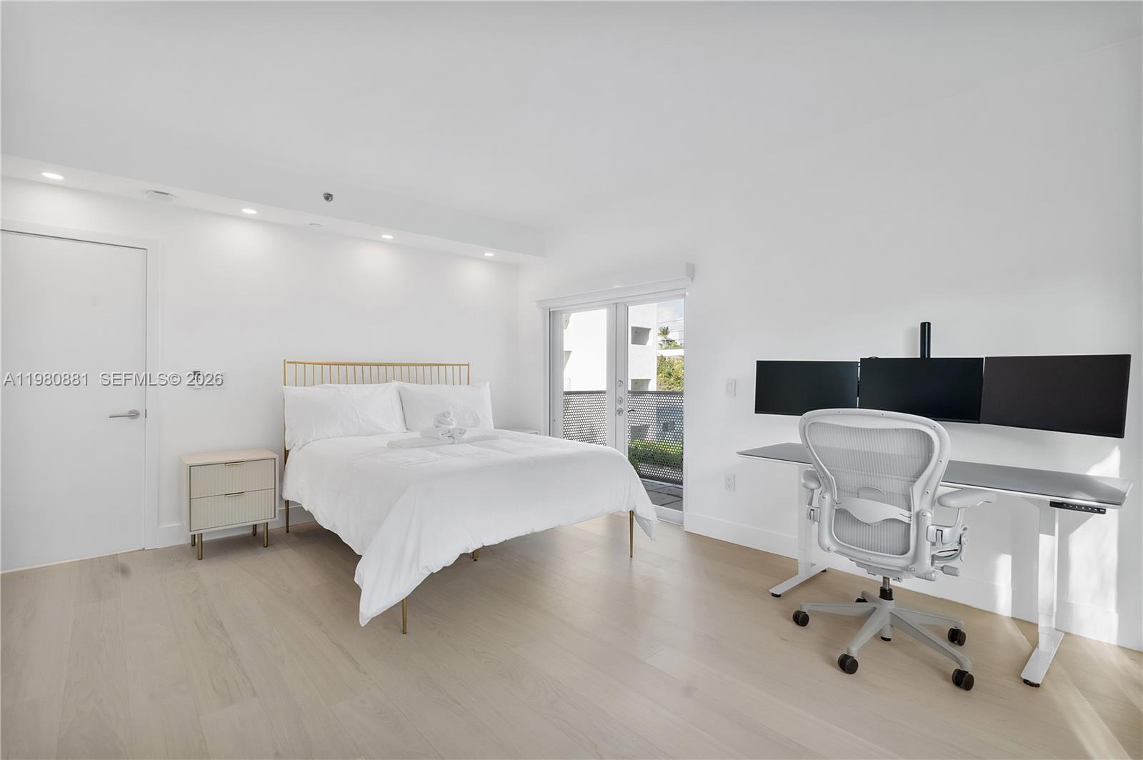 828 3rd Street, Unit 314 Miami Beach, FL 33139 - Photo 18 of 28 a large white bed in a white room