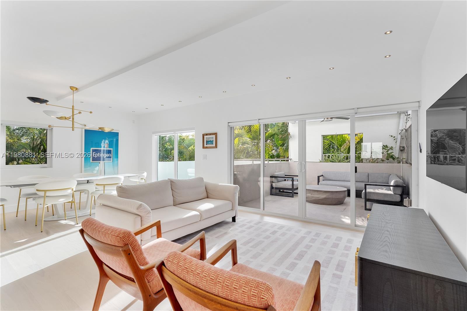 828 3rd Street, Unit 314 Miami Beach, FL 33139 - Photo 2 of 28 a living room with furniture and a large window