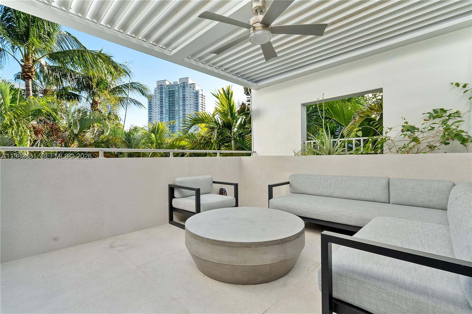 828 3rd Street, Unit 314 Miami Beach, FL 33139 - Photo 23 of 28 a living room with furniture and a potted plant
