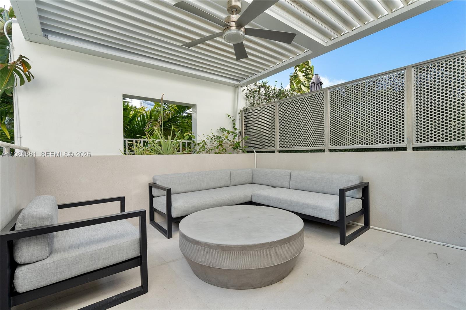 828 3rd Street, Unit 314 Miami Beach, FL 33139 - Photo 25 of 28 a living room with furniture and a window