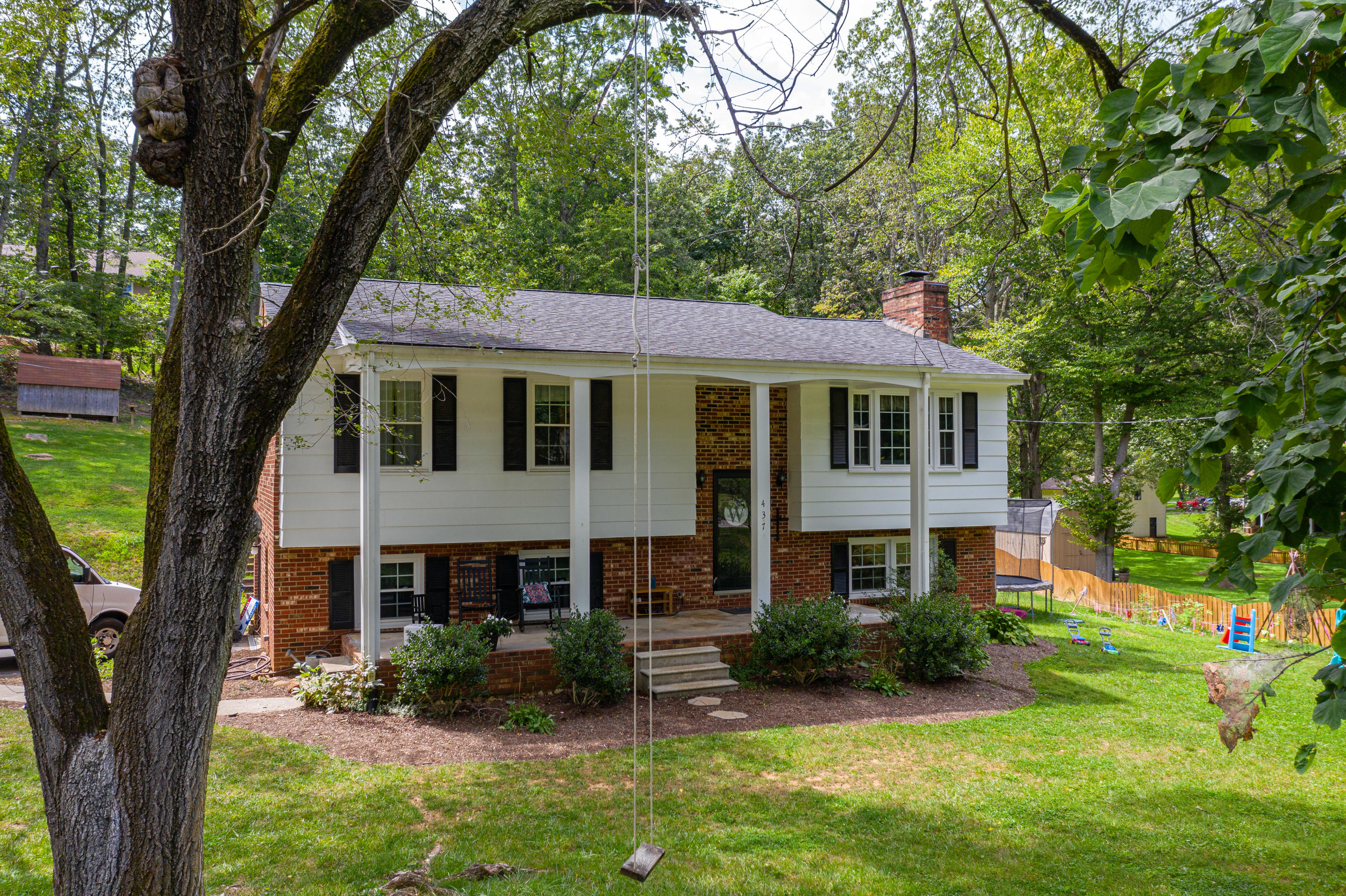 437 Pin Oak Drive Blue Ridge, VA 24064 - Photo 1 of 24 a front view of a house with garden