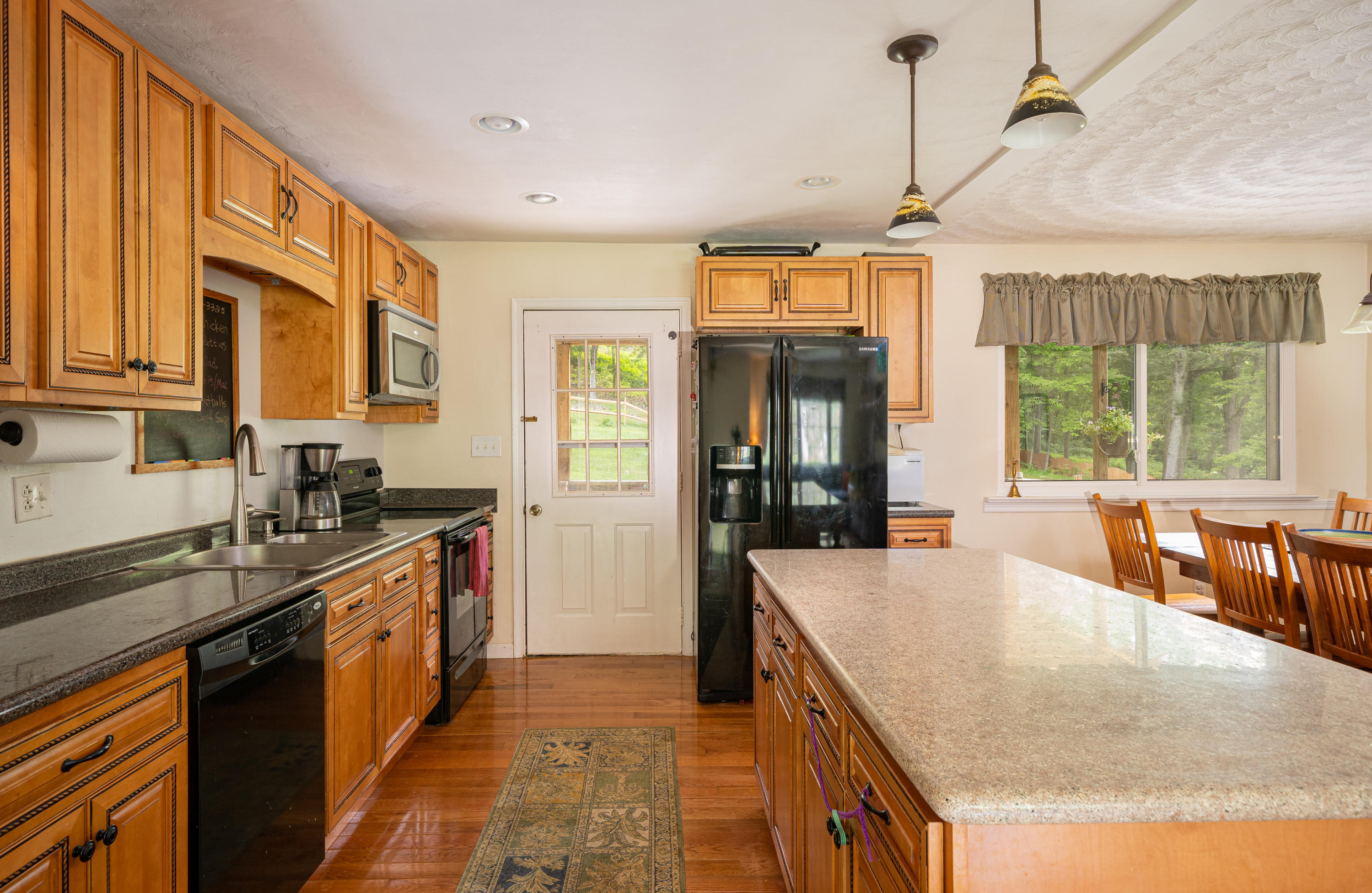 437 Pin Oak Drive Blue Ridge, VA 24064 - Photo 11 of 24 a kitchen with stainless steel appliances granite countertop a sink and cabinets