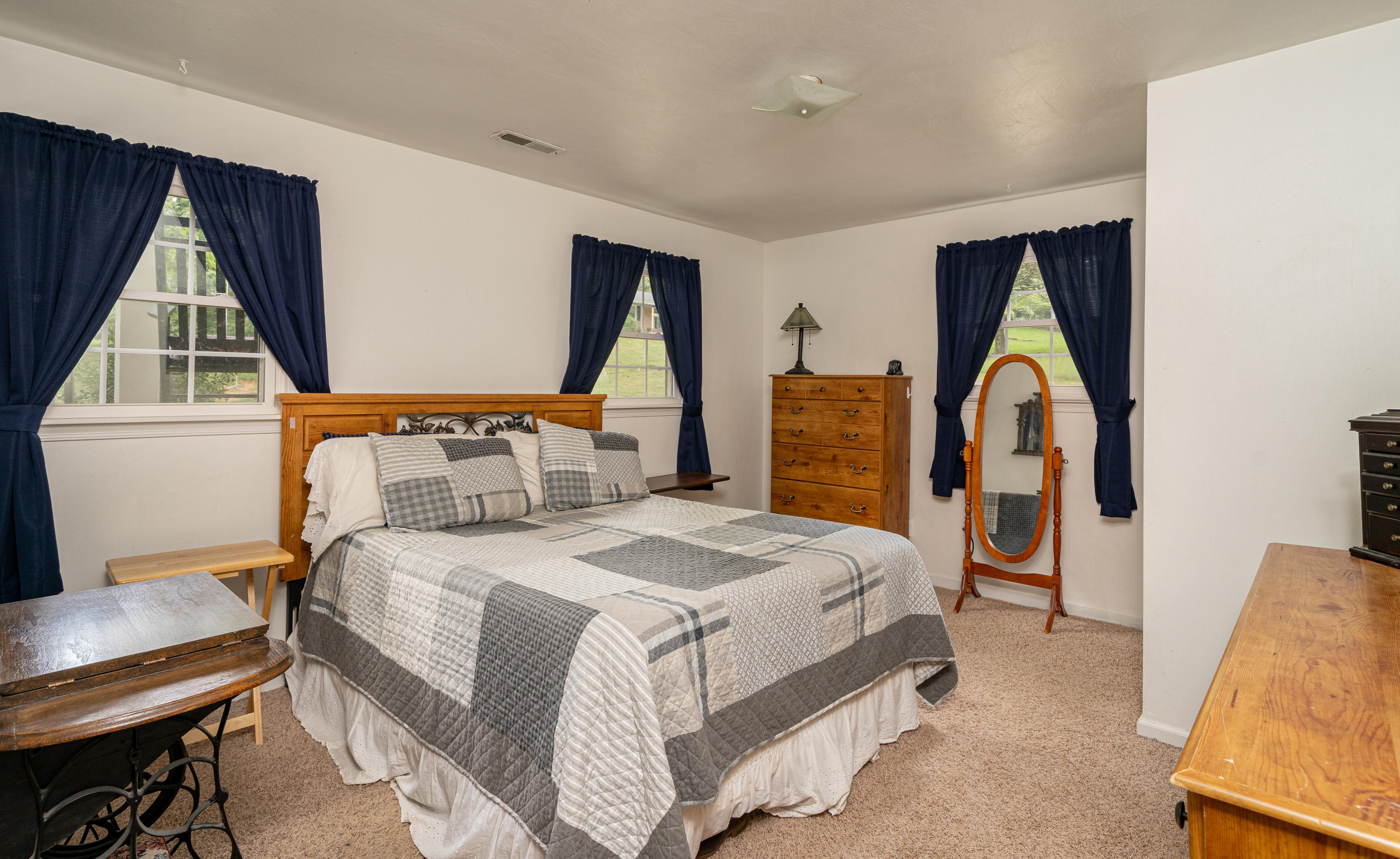 437 Pin Oak Drive Blue Ridge, VA 24064 - Photo 12 of 24 a bedroom with a bed and a window