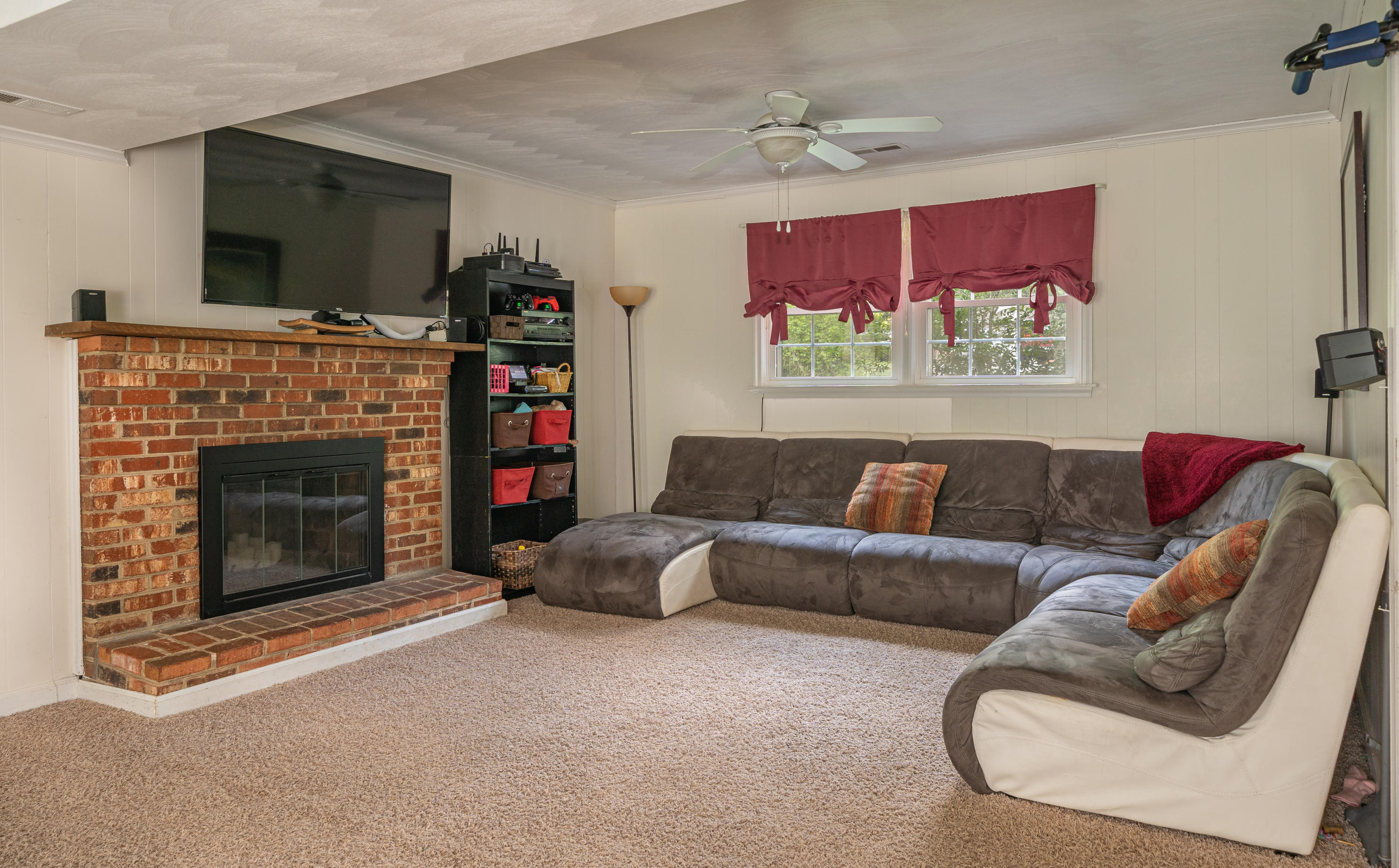 437 Pin Oak Drive Blue Ridge, VA 24064 - Photo 18 of 24 a living room with furniture a flat screen tv and a fireplace