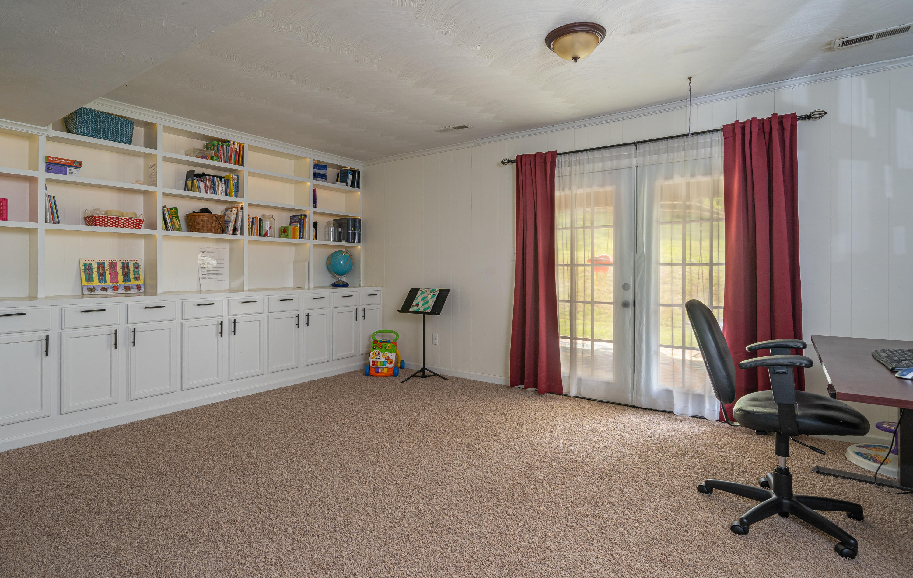437 Pin Oak Drive Blue Ridge, VA 24064 - Photo 20 of 24 a view of a workspace with furniture and a window