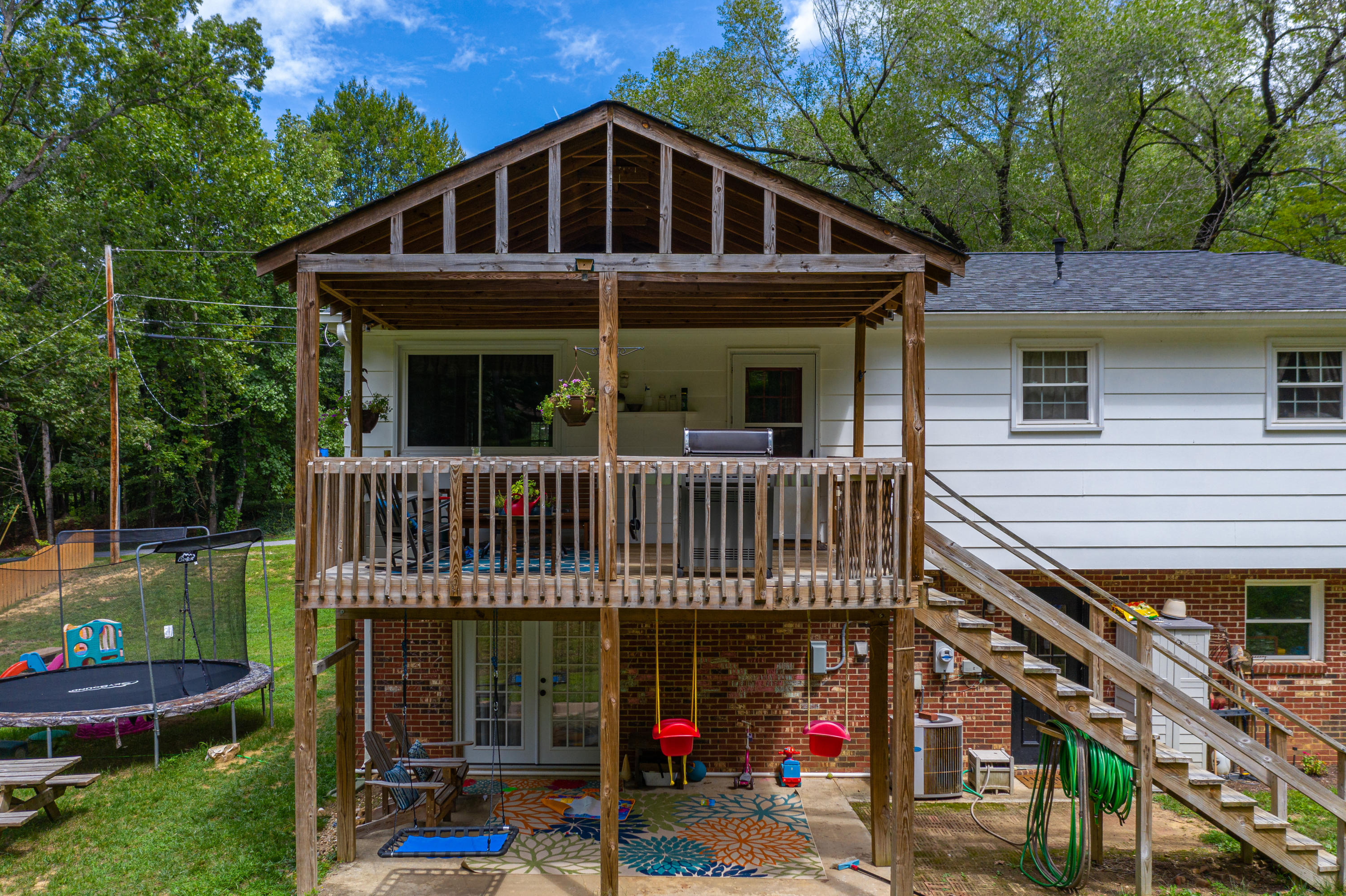 437 Pin Oak Drive Blue Ridge, VA 24064 - Photo 3 of 24 a view of a house with a yard and potted plants