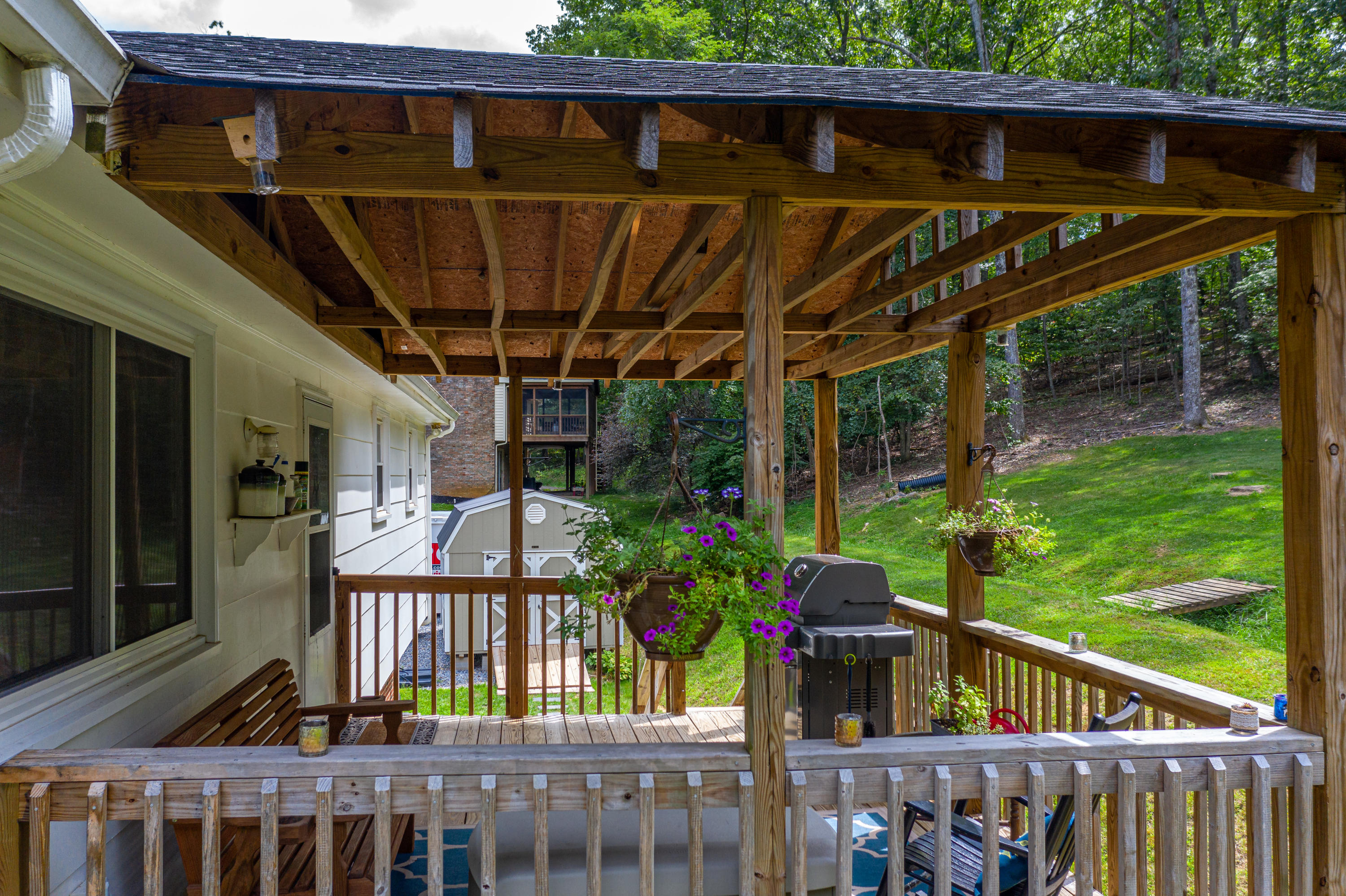 437 Pin Oak Drive Blue Ridge, VA 24064 - Photo 4 of 24 a view of a chairs on the deck