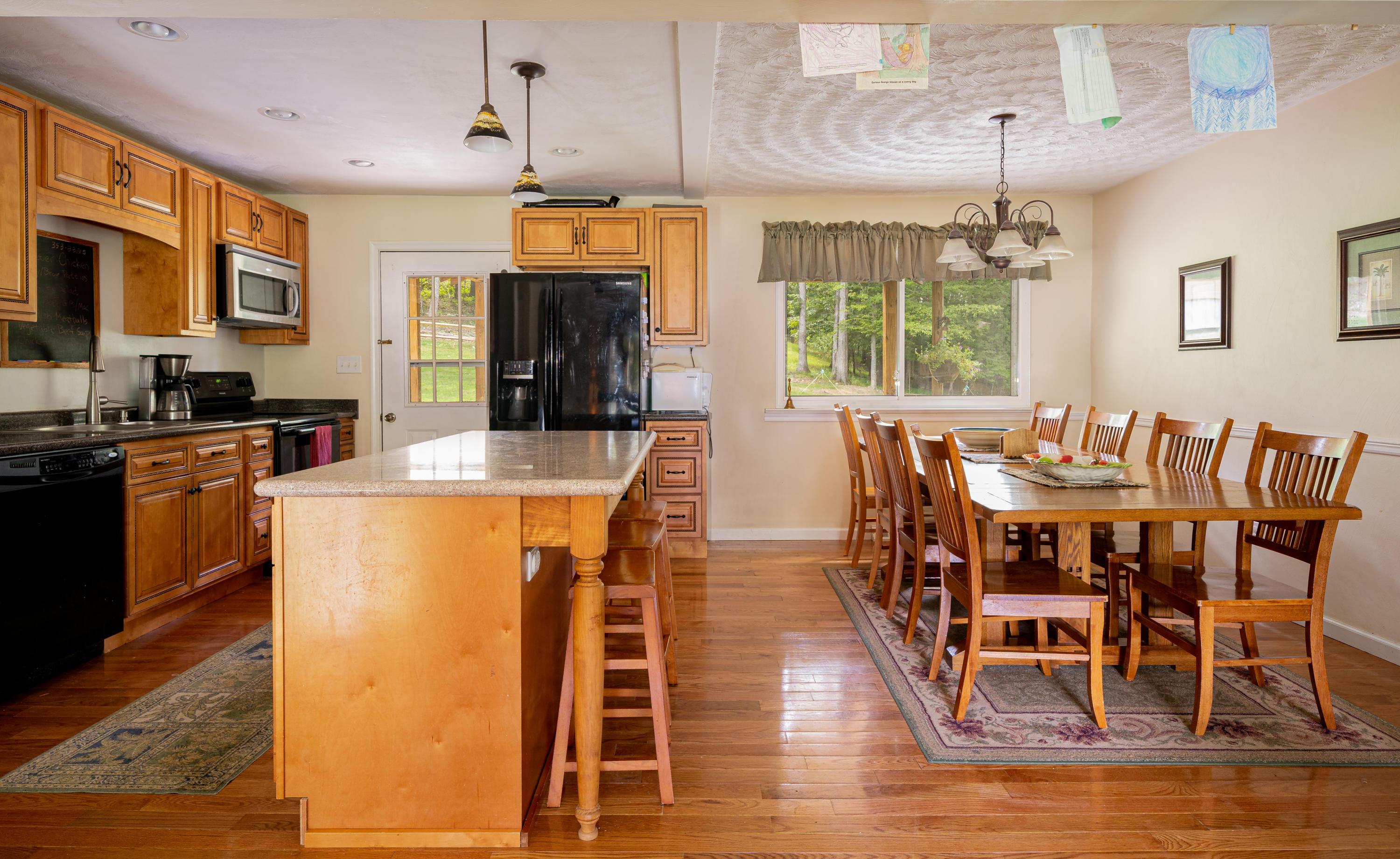 437 Pin Oak Drive Blue Ridge, VA 24064 - Photo 10 of 24 a view of a dining room with furniture window and wooden floor