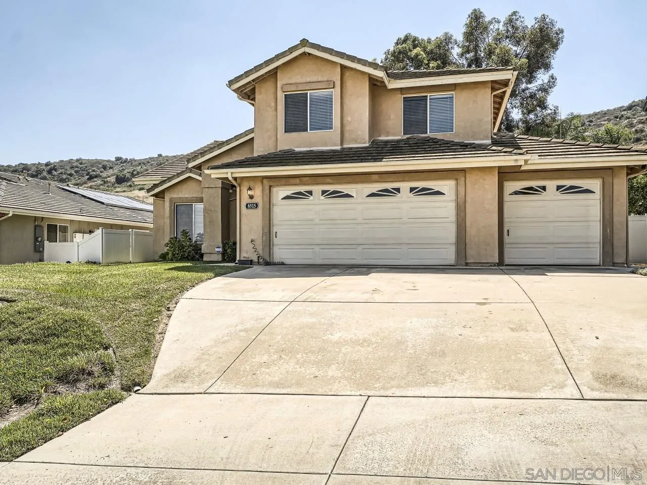 8515 Mesa Heights Road Santee, CA 92071 - Photo 1 of 28 a front view of a house with a yard