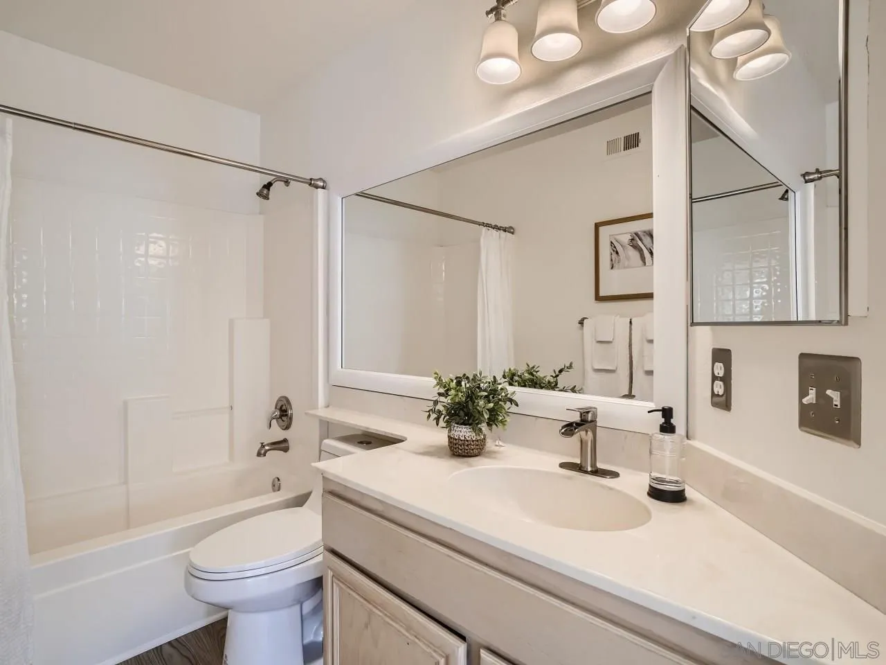 8515 Mesa Heights Road Santee, CA 92071 - Photo 16 of 28 a bathroom with a sink a toilet and shower