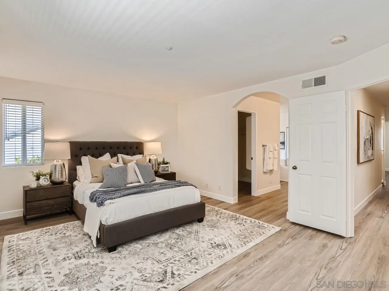 8515 Mesa Heights Road Santee, CA 92071 - Photo 18 of 28 a bedroom with a bed and a couch