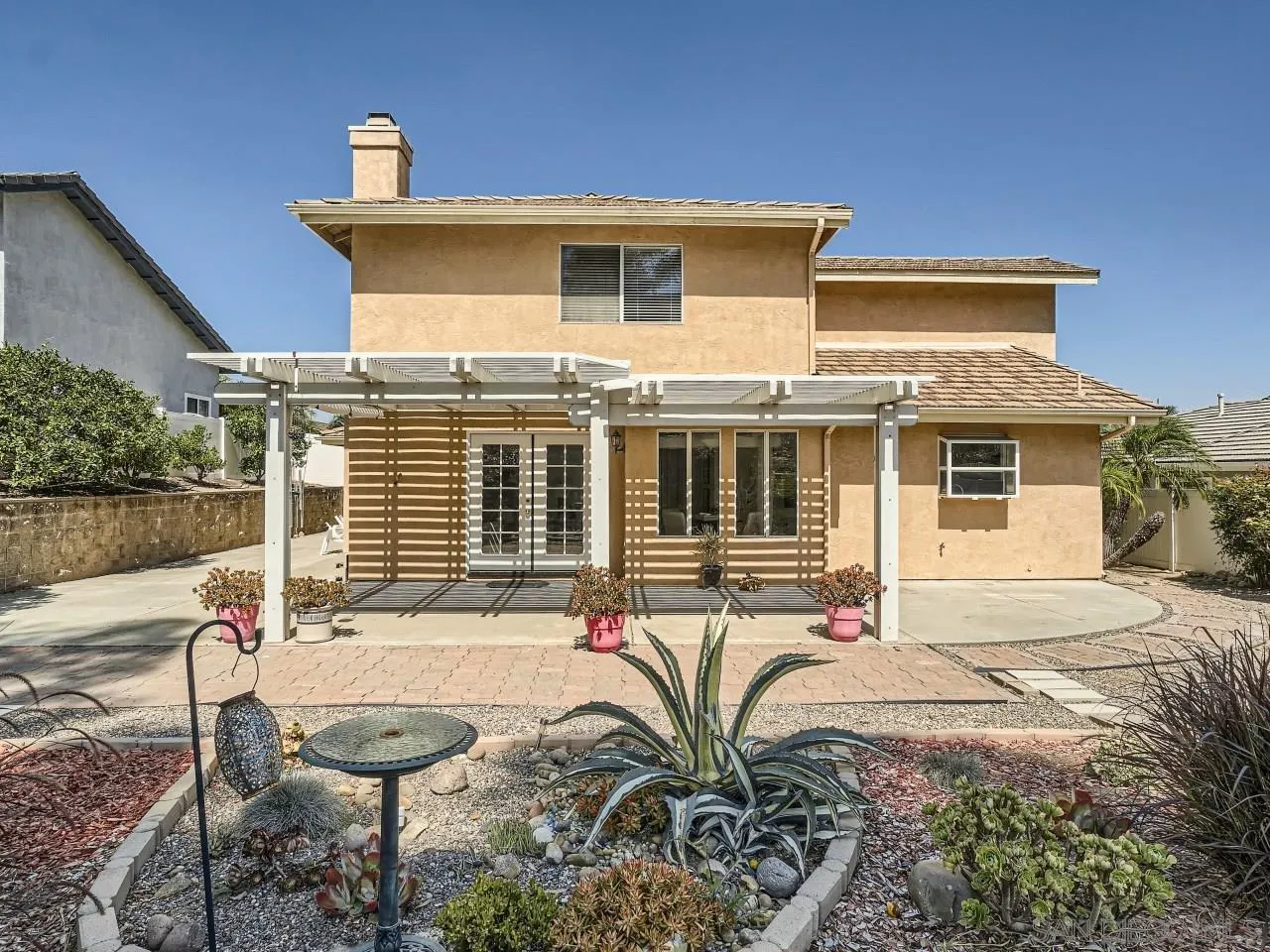 8515 Mesa Heights Road Santee, CA 92071 - Photo 27 of 28 a front view of a house with garden
