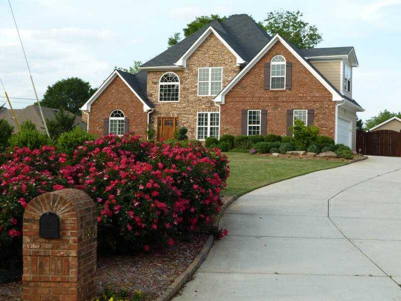 Exterior Front. CUSTOM BUILT HOME ON NEARLY 1 ACRE OF LAND