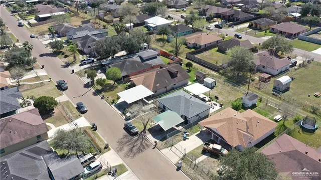 an aerial view of multiple houses with yard