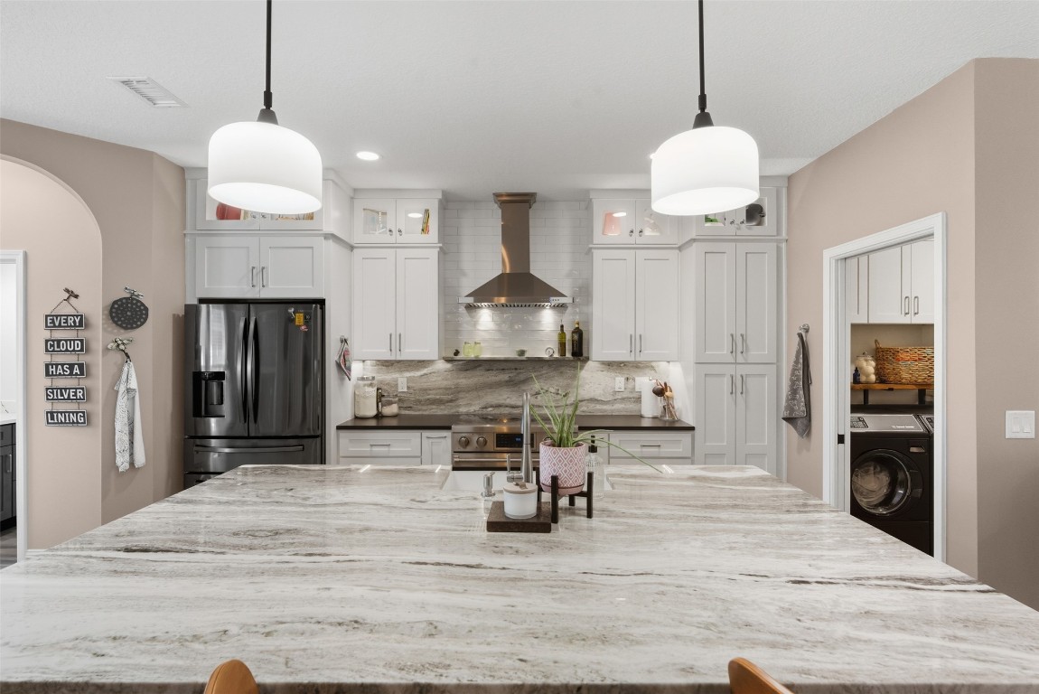 1250 Gum Leaf Road Jacksonville, FL 32226 - Photo 20 of 50 a living room with stainless steel appliances granite countertop furniture a fireplace a counter top space and living room view