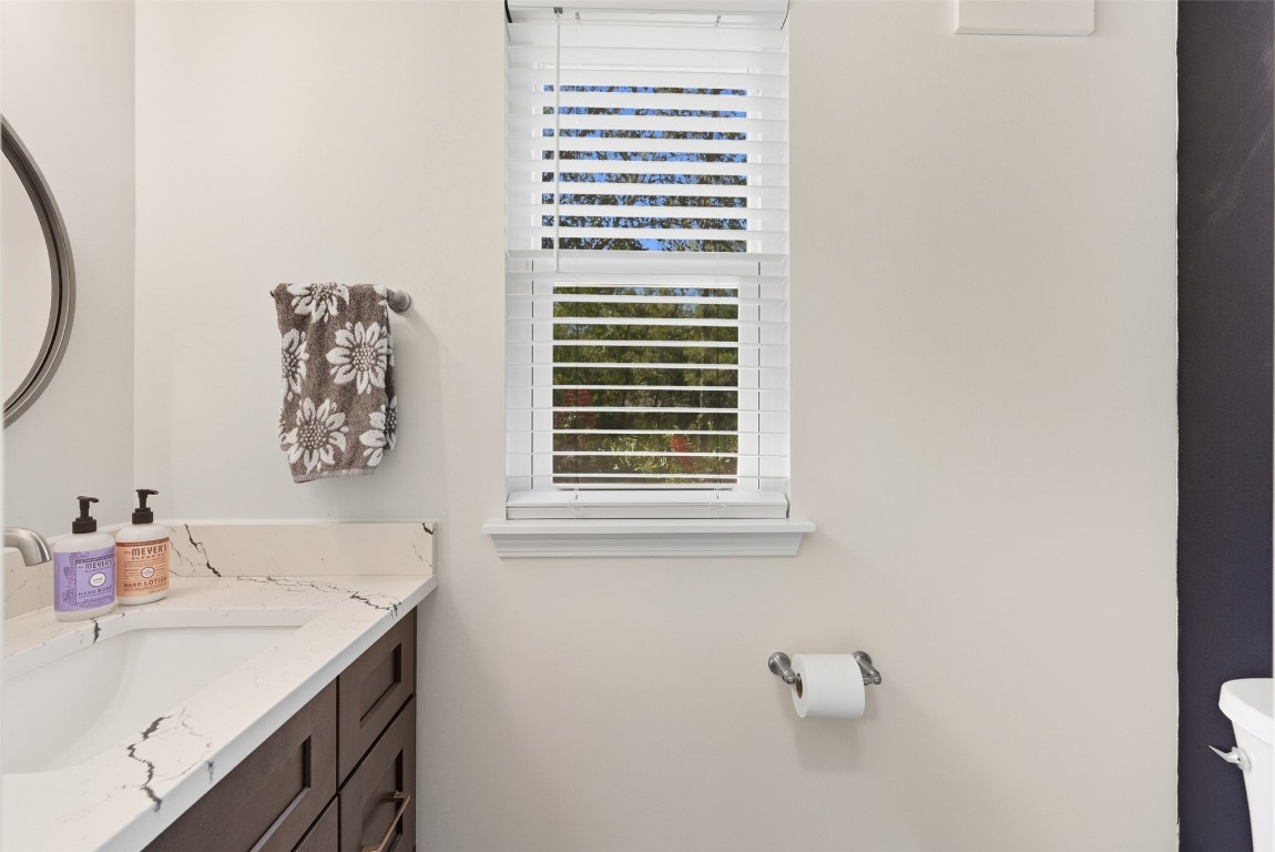 1250 Gum Leaf Road Jacksonville, FL 32226 - Photo 37 of 50 a bathroom with a sink and a mirror