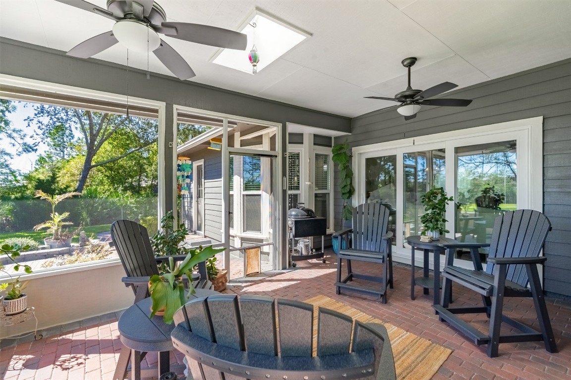 1250 Gum Leaf Road Jacksonville, FL 32226 - Photo 39 of 50 a dining room with furniture large windows and wooden floor