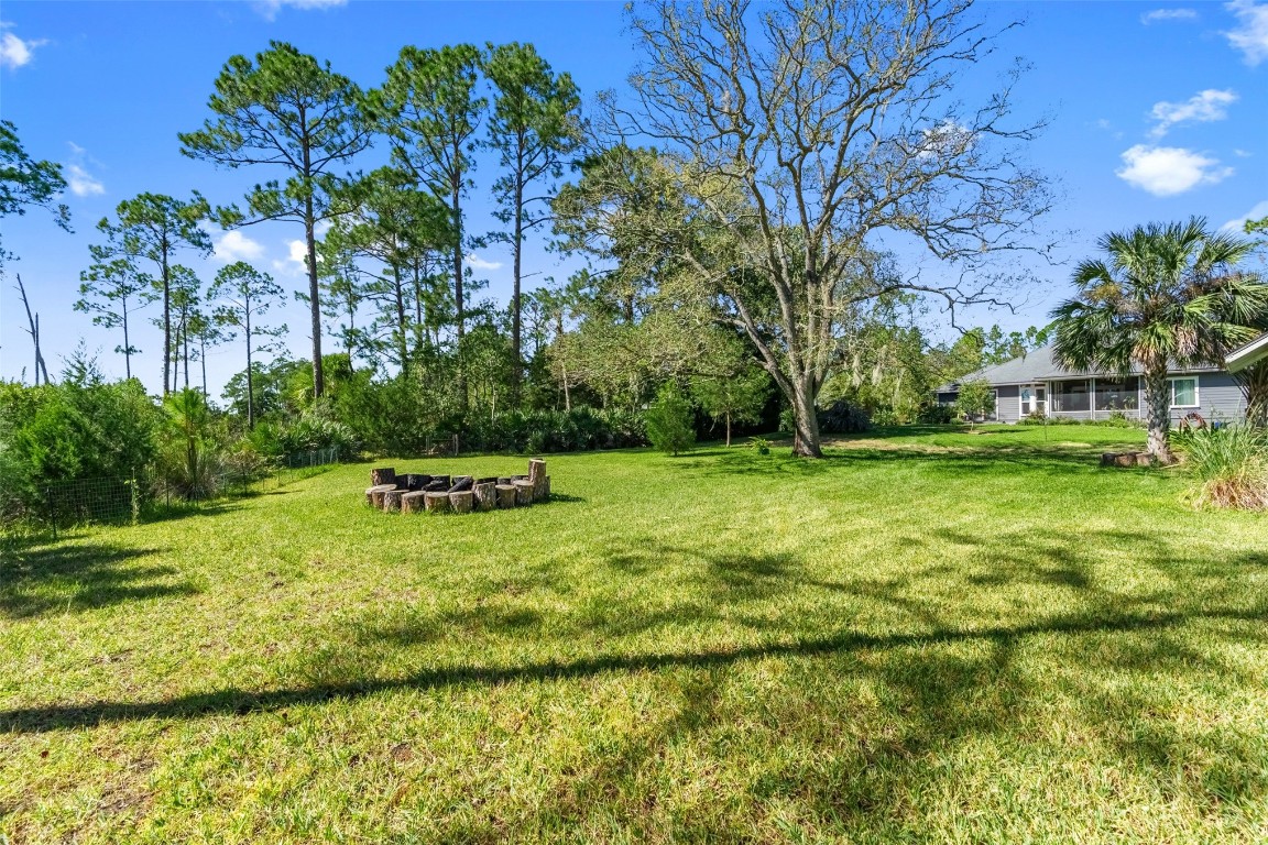 1250 Gum Leaf Road Jacksonville, FL 32226 - Photo 42 of 50 a backyard of a house with lots of green space