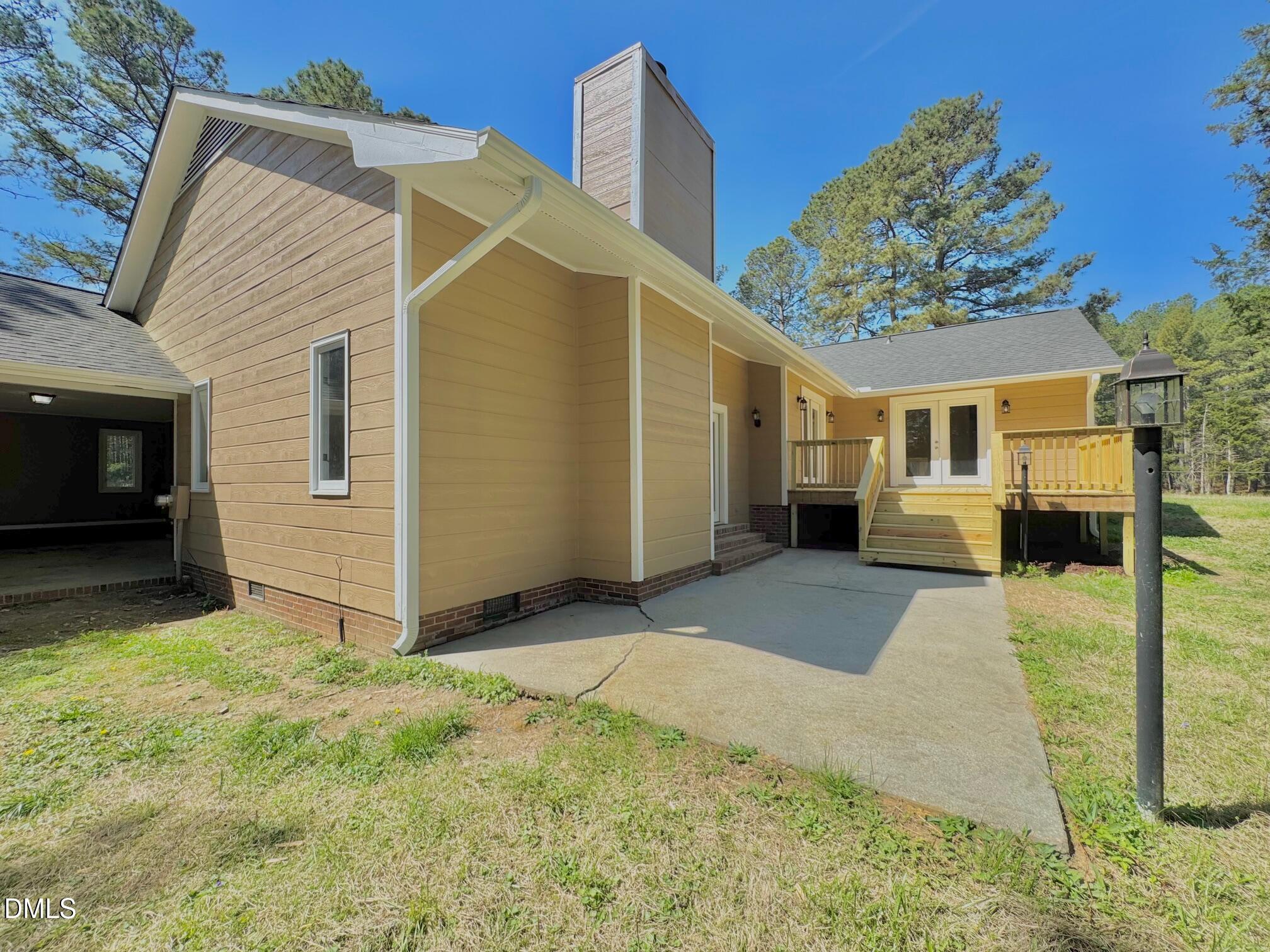 1720 Ross Mill Road Henderson, NC 27537 - Photo 4 of 42 a view of a house with a yard
