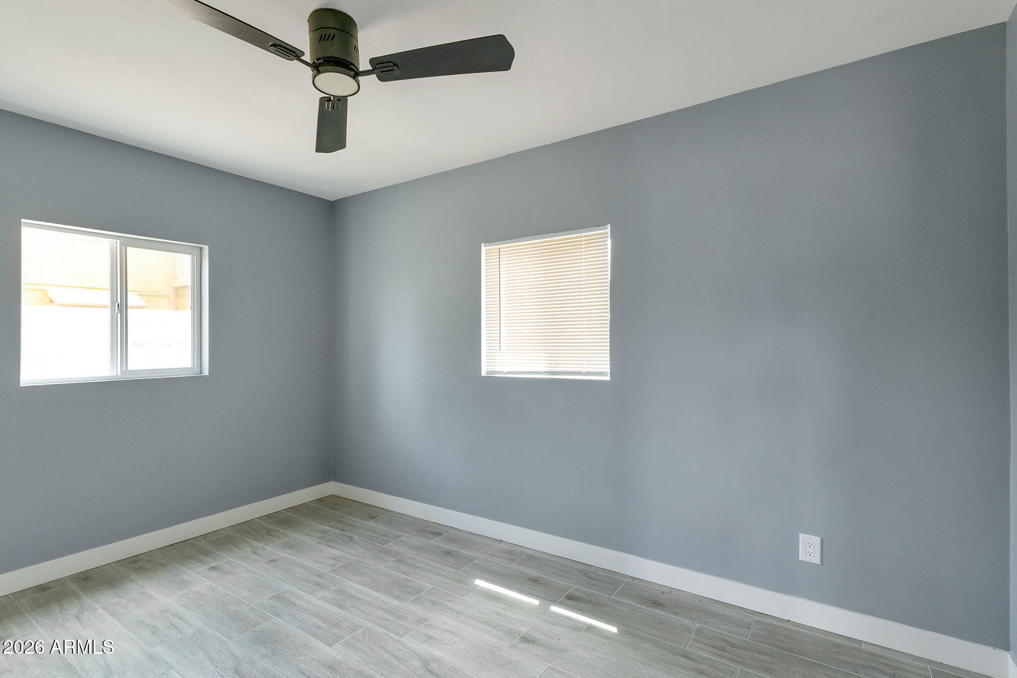 219 West Paseo Way Phoenix, AZ 85041 - Photo 11 of 14 an empty room with a window