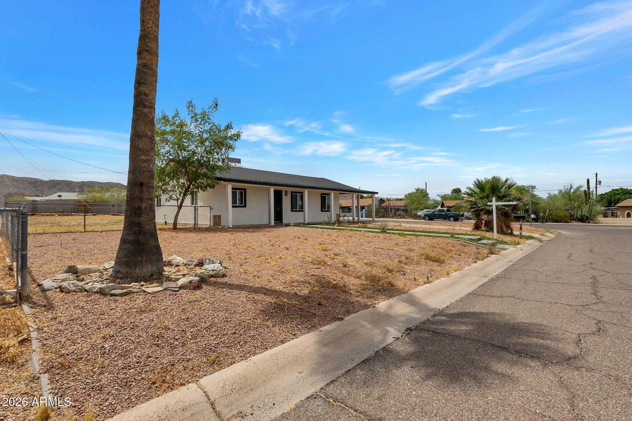 219 West Paseo Way Phoenix, AZ 85041 - Photo 2 of 14 a view of a house with a yard