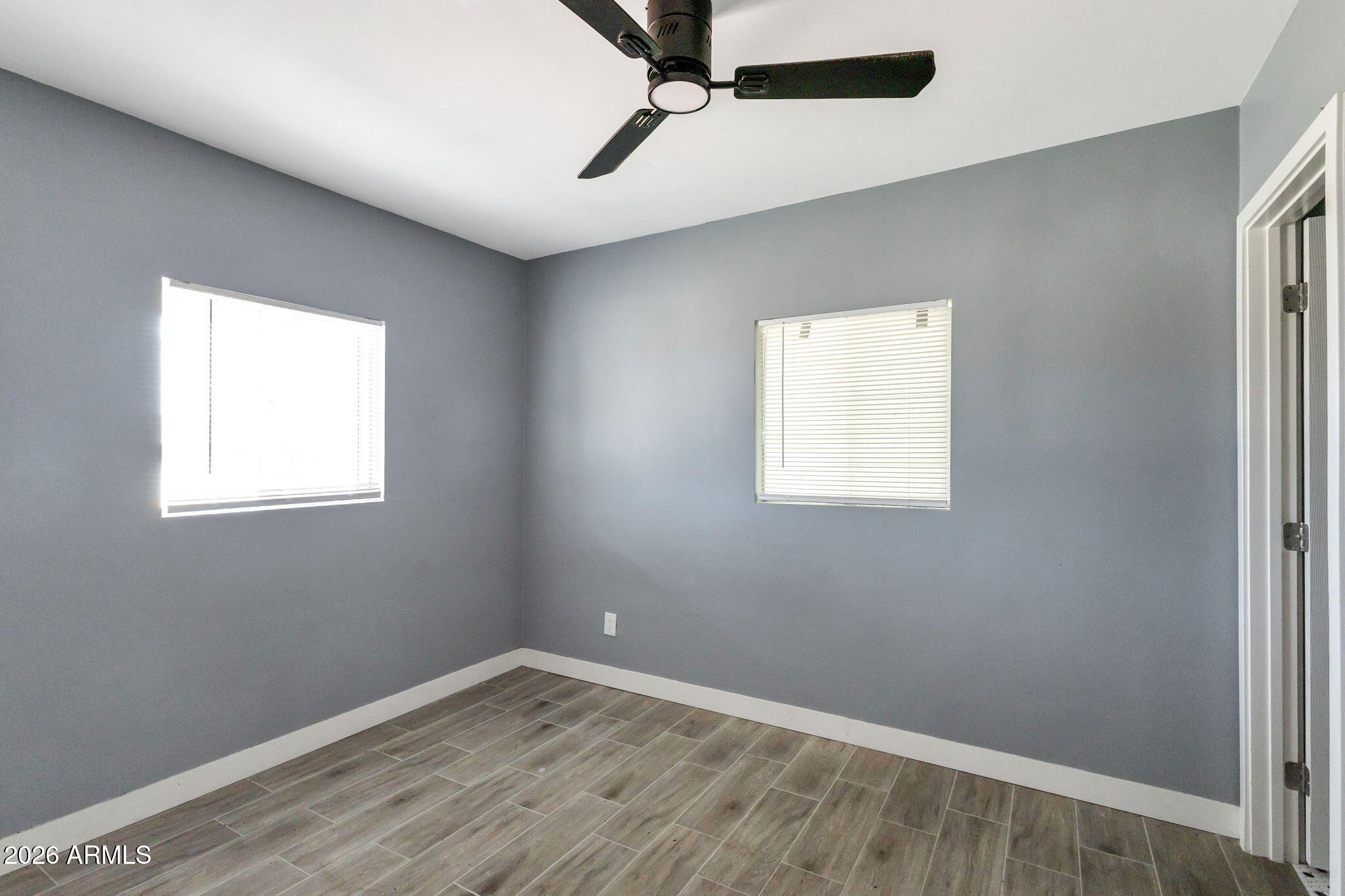 219 West Paseo Way Phoenix, AZ 85041 - Photo 6 of 14 an empty room with a window