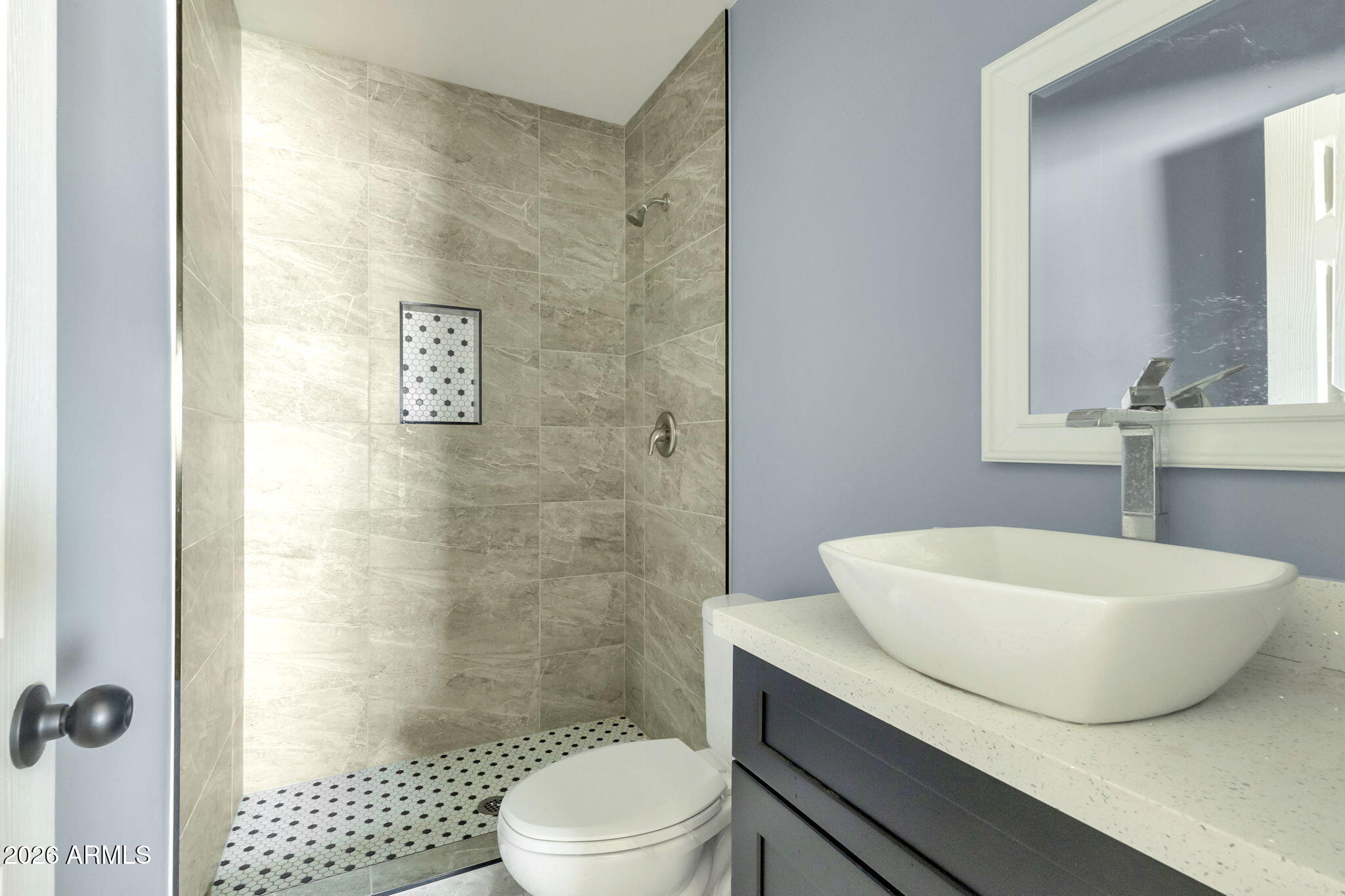 219 West Paseo Way Phoenix, AZ 85041 - Photo 8 of 14 a bathroom with a sink a toilet and shower