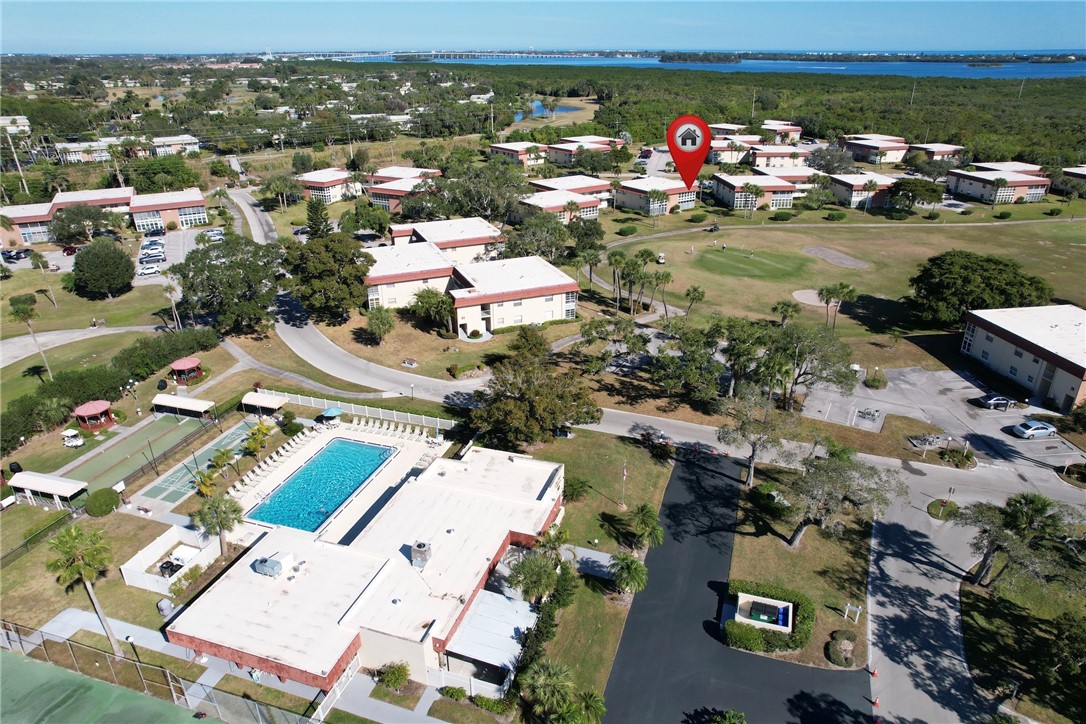 105 Spring Lake Court, Unit 207 Vero Beach, FL 32962 - Photo 31 of 34 an aerial view of a house with a lake view