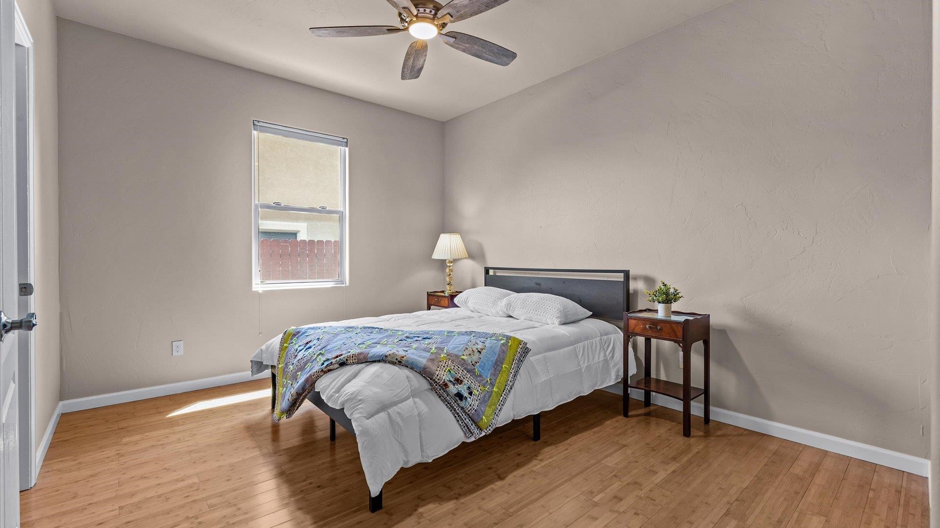 1712 Powis Lane Fruita, CO 81521 - Photo 24 of 39 a bedroom with a bed and a window
