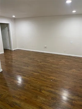 a view of room with wooden floor