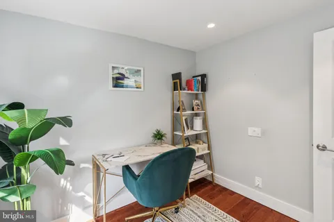 a workspace with furniture and wooden floor