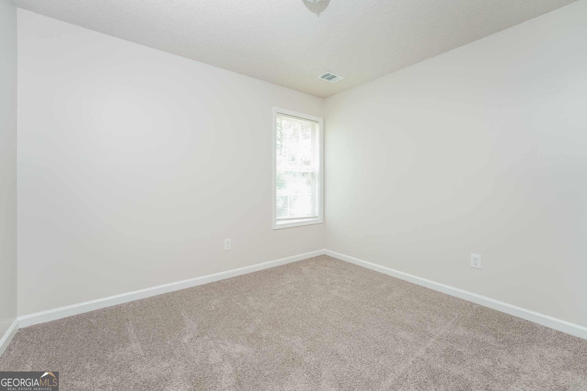 6930 Red Bone Way Lithonia, GA 30038 - Photo 12 of 17 an empty room with a window