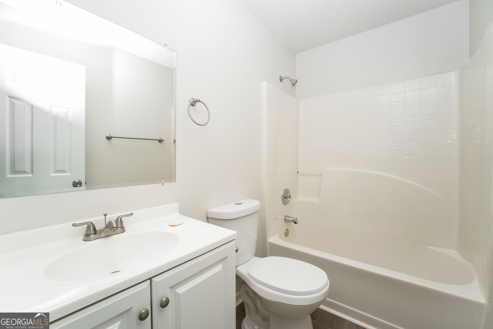 6930 Red Bone Way Lithonia, GA 30038 - Photo 13 of 17 a bathroom with a sink toilet vanity and shower