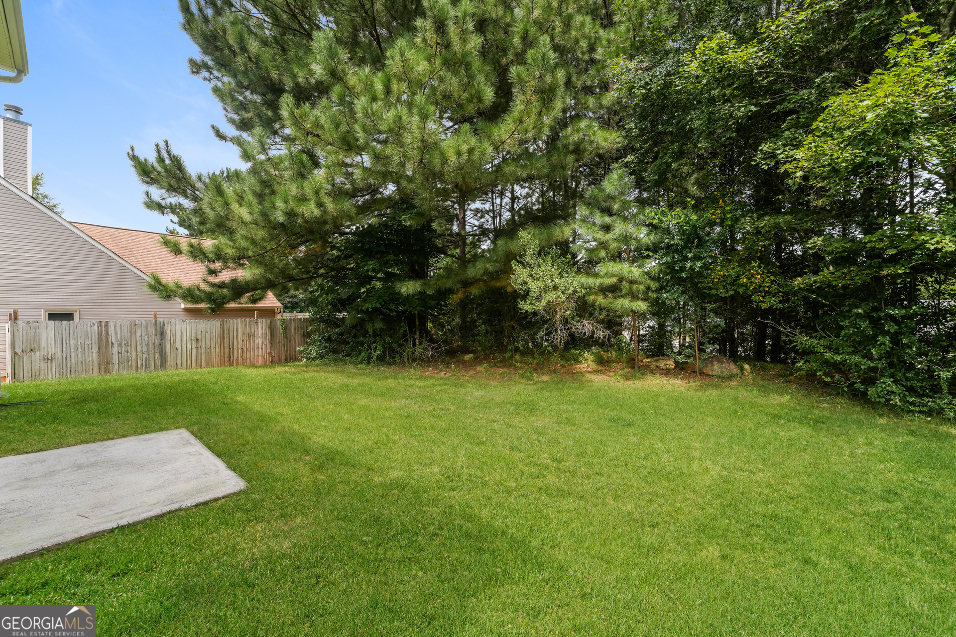 6930 Red Bone Way Lithonia, GA 30038 - Photo 15 of 17 a view of a backyard