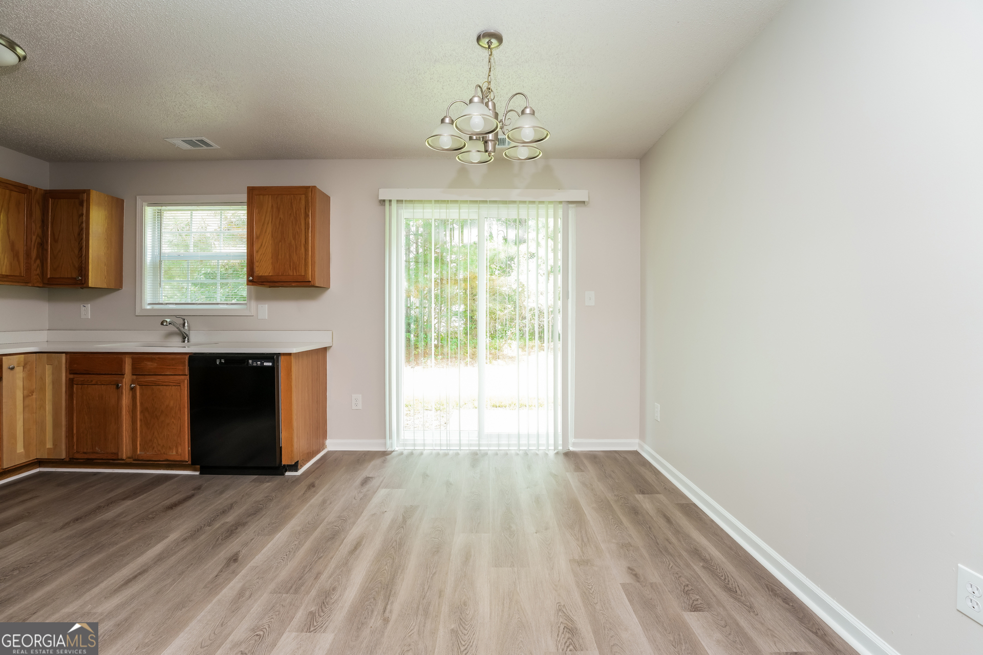 6930 Red Bone Way Lithonia, GA 30038 - Photo 4 of 17 a view of livingroom with kitchen