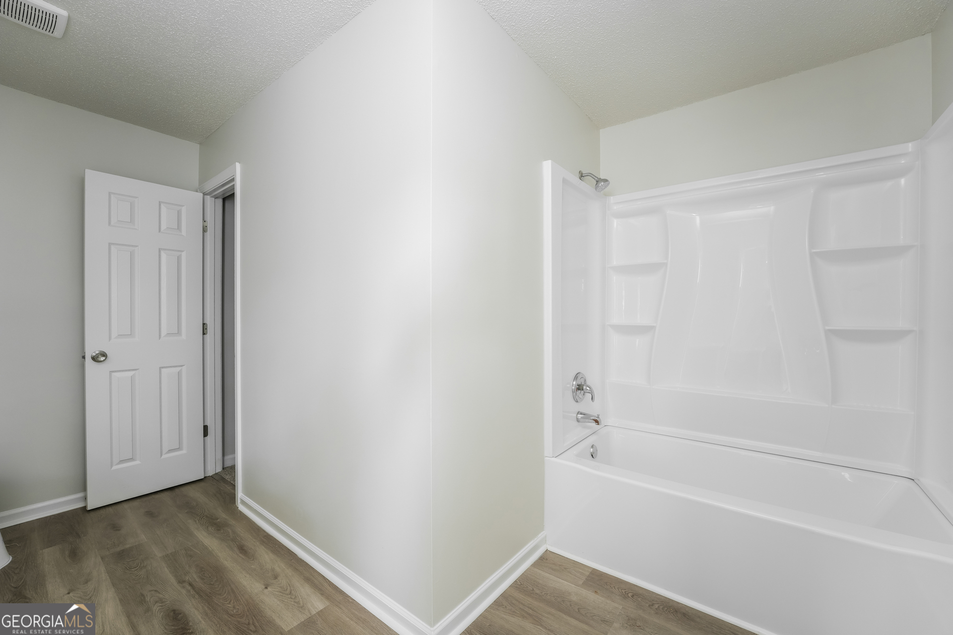 6930 Red Bone Way Lithonia, GA 30038 - Photo 10 of 17 a bathroom with a bathtub