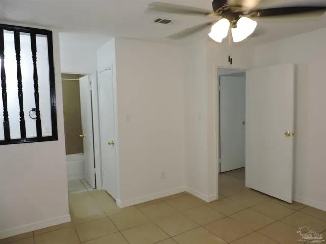 a view of an empty room and a window