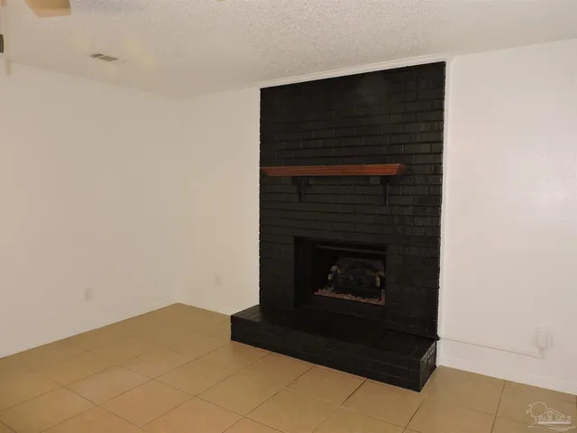 a living room with a fireplace