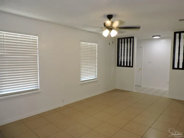 a view of entryway and hall with a chandelier