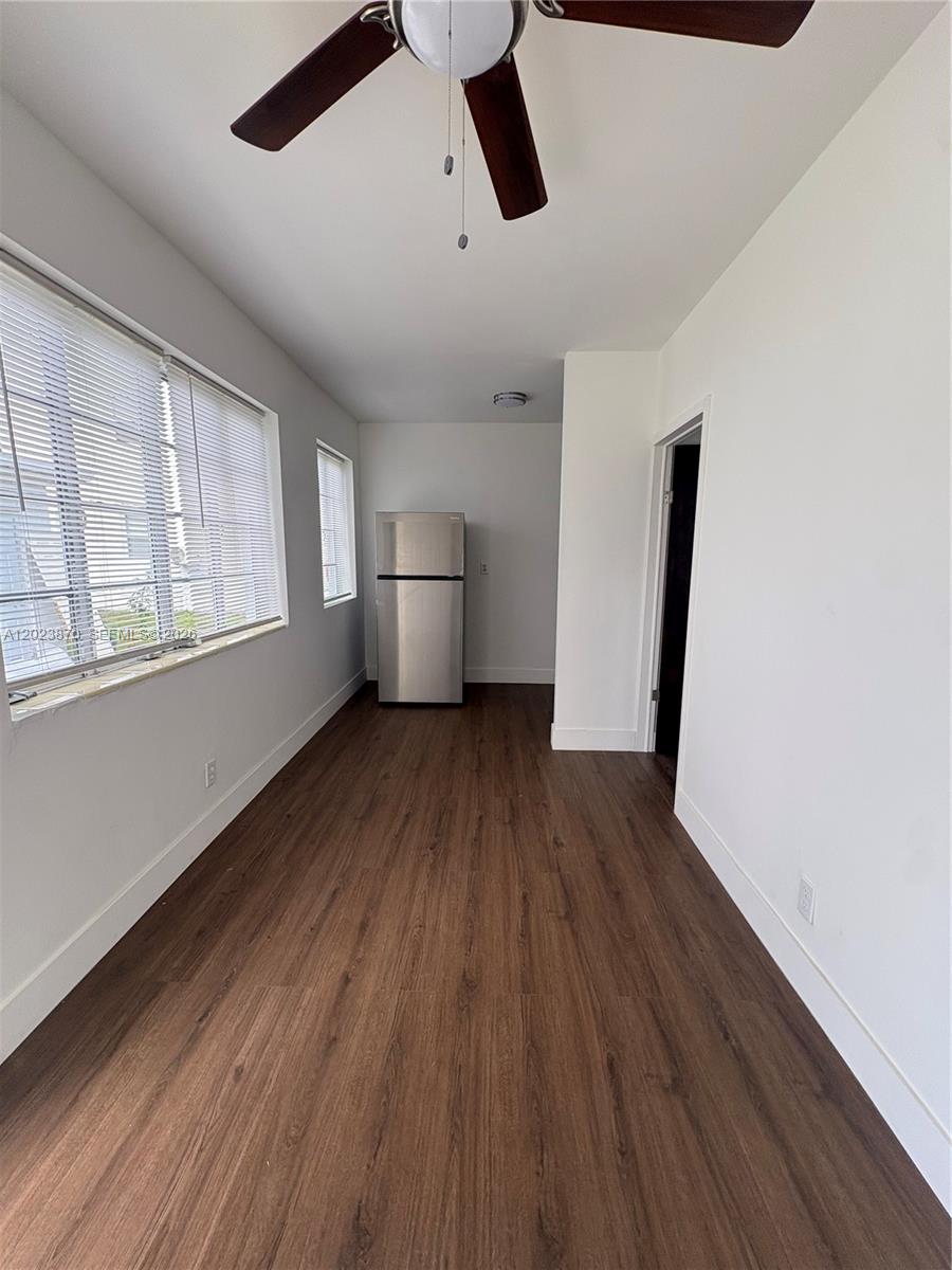 2052 Southwest 7th Street, Unit 4 Miami, FL 33135 - Photo 4 of 10 a view of empty room with wooden floor and window