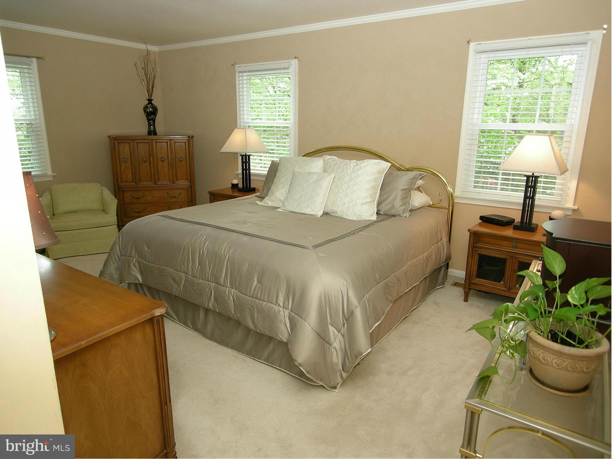 13909 Foxland Road Phoenix, MD 21131 - Photo 16 of 27 a bedroom with a bed and a window
