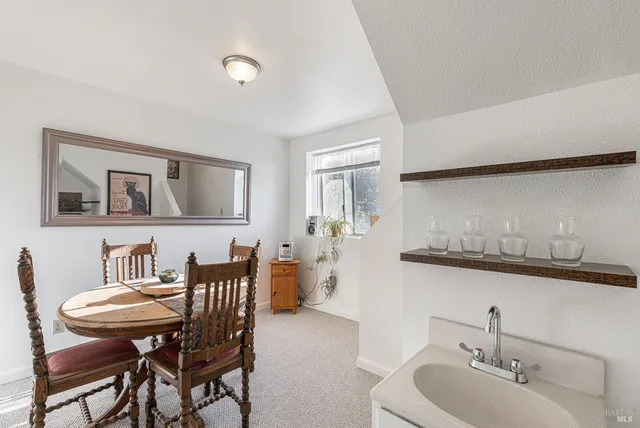 a view of a dining room with furniture
